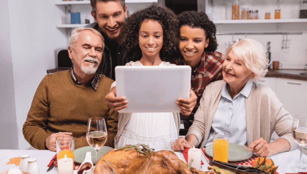 Family Enjoys Using a Tablet at Thanksgiving