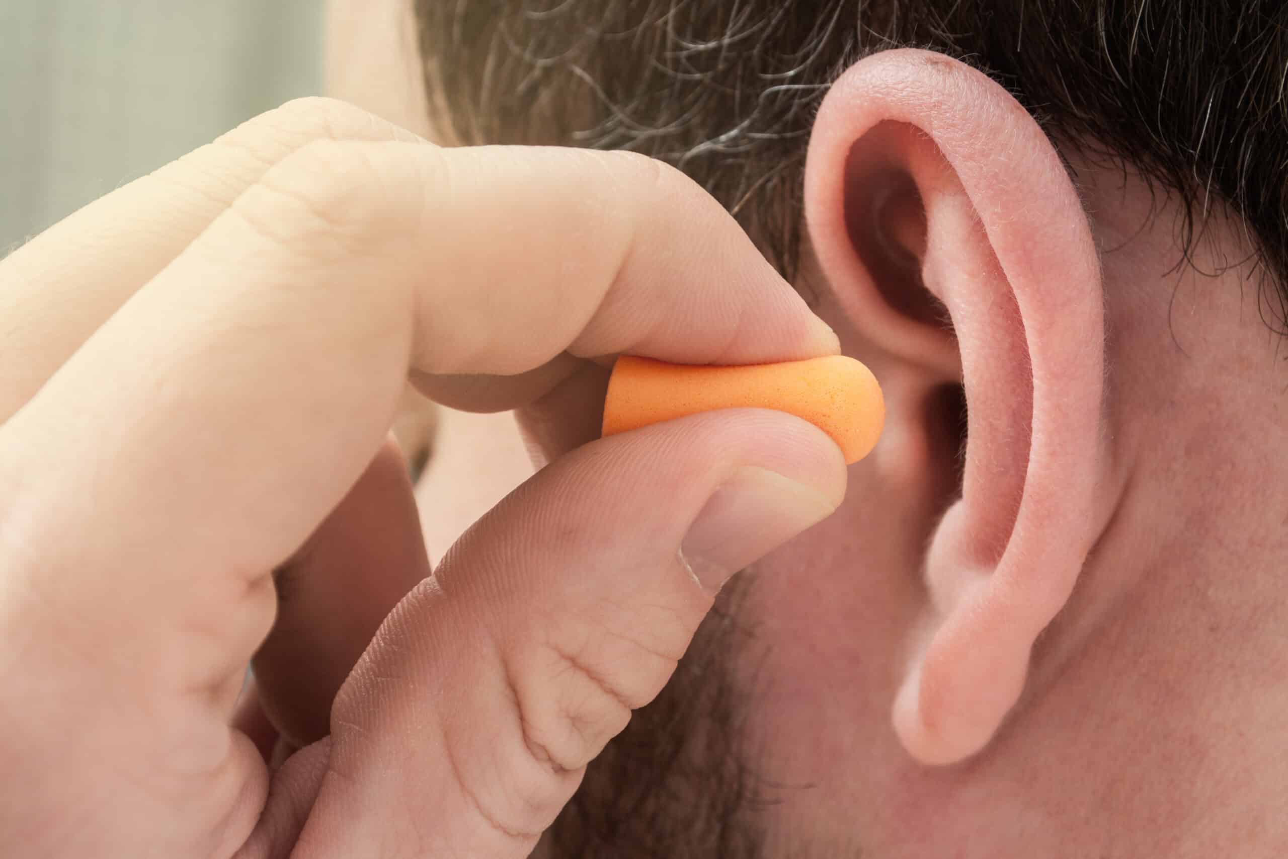 Putting Ear Plug In Ear Tips to Safeguard Your Hearing During DIY Home Improvement Projects ...